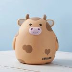 Tirelire vache joyeuse pour apprendre à épargner