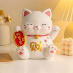 Tirelire décorative chat patte en résine