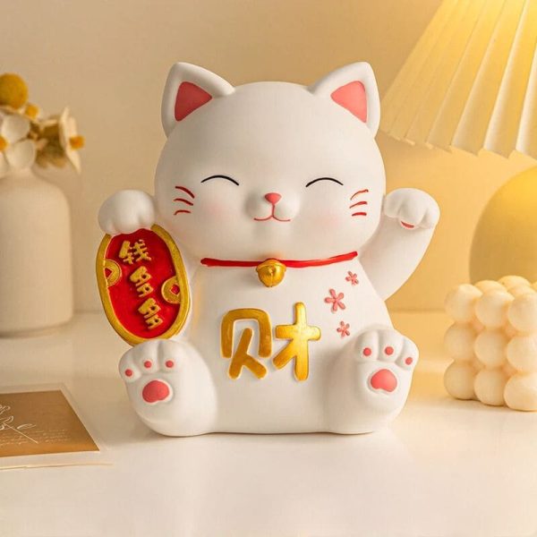 Tirelire décorative chat patte en résine