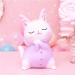Tirelire en céramique représentant un chat rose