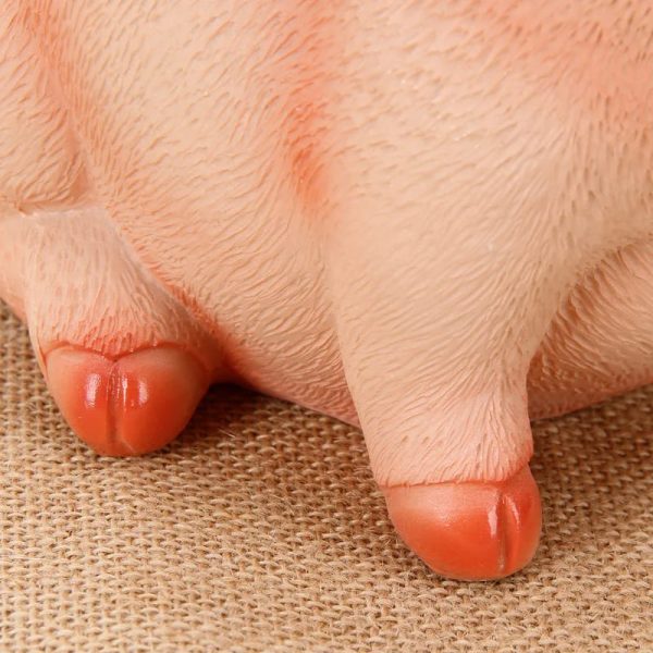 Cochon assis, tirelire pour petits et grands