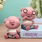 Tirelire cochon drôle en céramique colorée