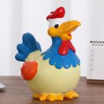 Tirelire coq amusante pour apprendre à épargner