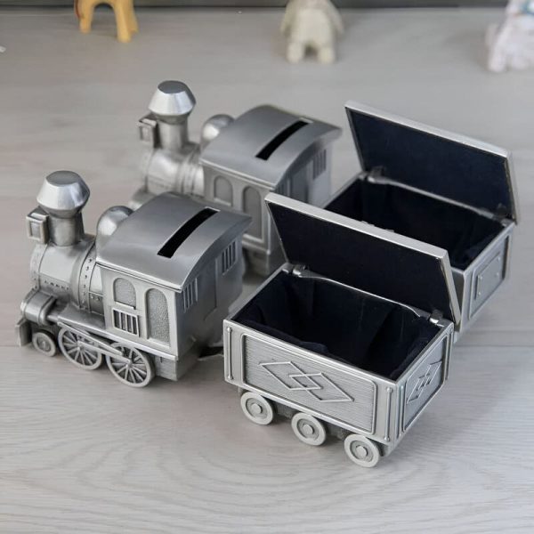 Tirelire argentée en forme de locomotive