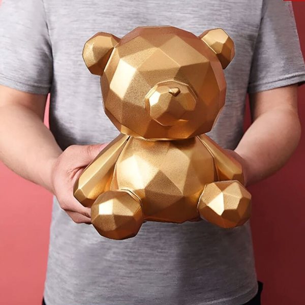 Accessoire de décoration : tirelire ours en or