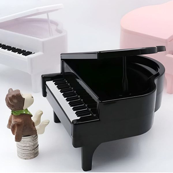 Tirelire musicale en forme de piano, incite à économiser