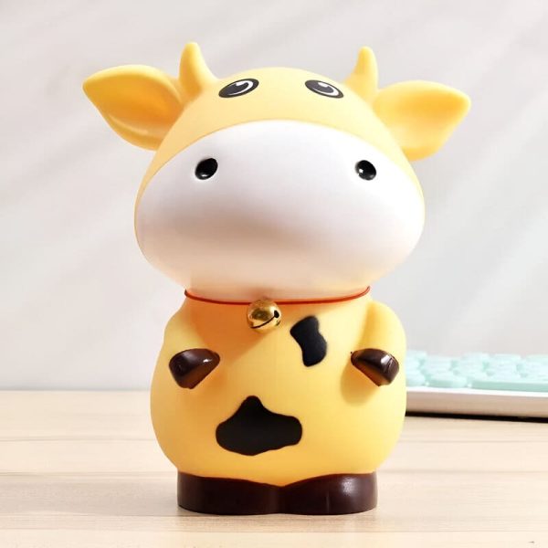 Tirelire vache en couleurs vives, parfait pour les petits épargnants