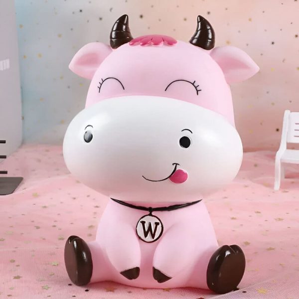 Vache rose tirelire, accessoire ludique et pratique