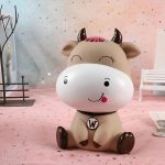 Vache rose, tirelire amusante pour les petits